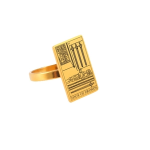 Gold stainless steel tarot card ring featuring the Four of Swords design on white background