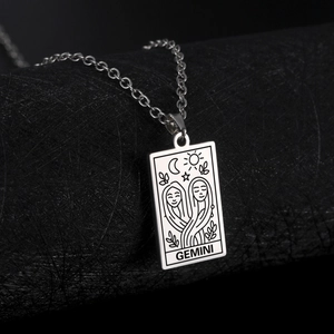 Silver Gemini tarot card necklace with celestial sun and moon engraving on rectangle pendant