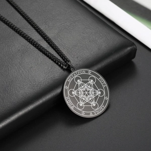 Macro shot of black Metatron's Cube pendant with laser engraved sacred geometry