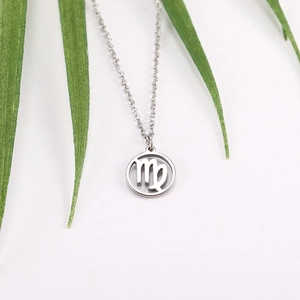 Detailed close-up of a silver Virgo constellation pendant necklace on a clean white backdrop
