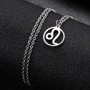Polished stainless steel Leo zodiac necklace with hollow circular pendant on black background