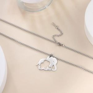 Detailed macro view of silver hollow elephant pendant with lobster clasp and chain link