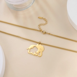 Detail of gold elephant pendant with hollow design and adjustable lobster clasp chain
