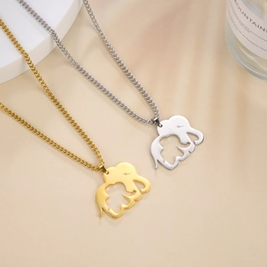 Detailed view of elephant mother and child pendants in gold and silver plating