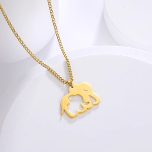 Close-up of golden elephant mother and child cutout pendant on minimalist chain