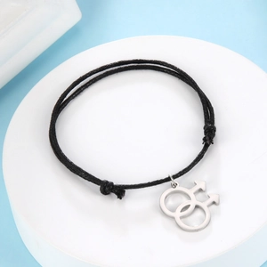 Detail view of black knotted wax cord bracelet with silver double male symbol charm