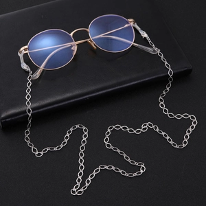 Detailed close-up of rose gold round anti-blue light glasses with a silver metal link chain