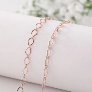 Rose gold hollow diamond link eyewear chain with textured oval rings for women