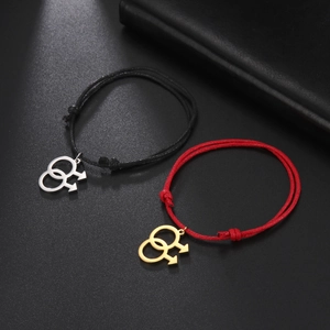 Detail of adjustable braided cords with gold and silver double male symbol pendants