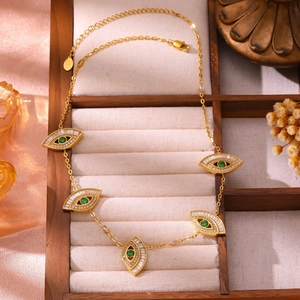 Gold stainless steel necklace with five green evil eye charms and white zircon stones