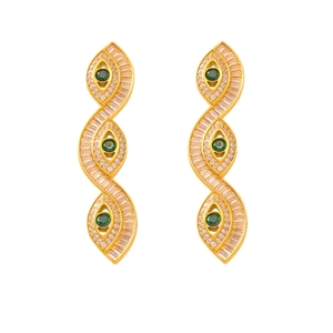 Golden wave earrings with green eye-shaped charms and sparkling crystals on white base