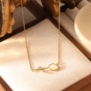 Gouden roestvrijstalen tulp ketting met kattenoog steen en zirkonia hanger