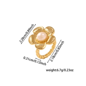Detail of 18K gold plated flower ring with pink pearl and textured twisted band