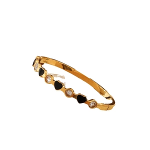 Gold stainless steel bangle with black enamel hearts and clear zircon stones