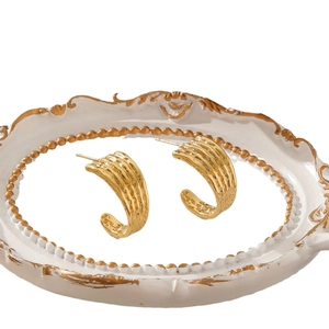 Elegant vintage C-shaped gold hoop earrings with textured ripple design for women