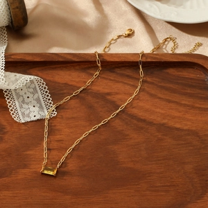 Modern gold paperclip chain necklace with a yellow rectangular claw-set zircon pendant