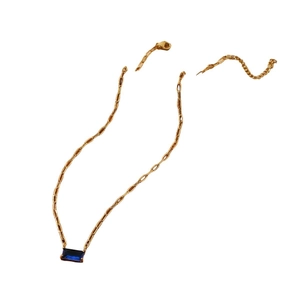Gold paperclip chain necklace featuring a blue rectangular gemstone pendant for women