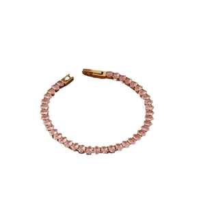 Elegant 18k gold plated tennis bracelet featuring oval pink cubic zirconia stones on white back