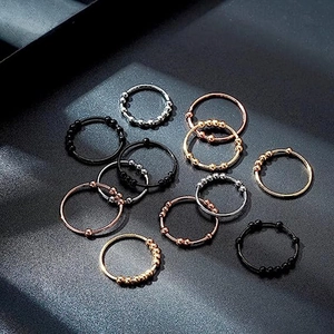 Titanstahl-Angstring mit beweglichen Perlen in Gold, Silber, Roségold und Schwarz poliert