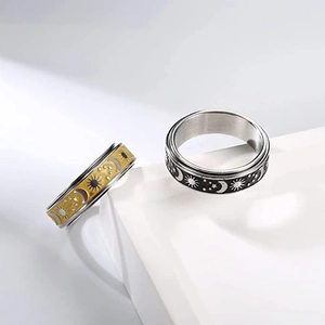 Minimalist stainless steel spinner ring set with vintage sun, moon and star engraving
