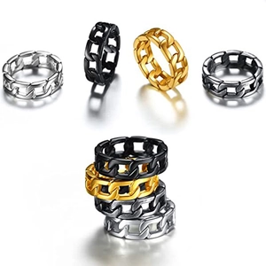 Macro shot of Cuban chain link rings in gold, silver, black and antique silver steel