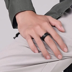 Retro black stainless steel spinner ring for men featuring vintage engraved scroll patterns