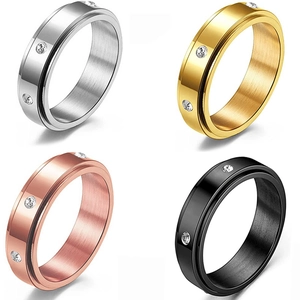 Rotating stainless steel spinner ring set with brushed finish and zircon inlay