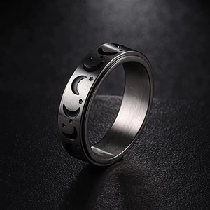 Rotating stainless steel spinner ring featuring moon phase and stars engraving