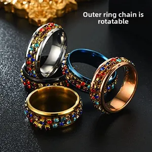 Rotating stainless steel rings with colorful zircon crystals in four metallic colors