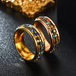 Close-up of titanium steel rotating rings with colorful pave set cubic zirconia crystals