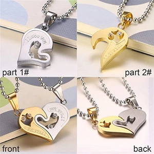 Detail of interlocking stainless steel heart necklace with I Love You engraving and rhinestones