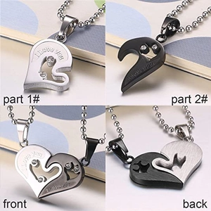 Detail view of heart-shaped couple necklaces set with I Love You engraving and small crystals