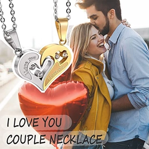 Detail of interlocking heart necklaces with I Love You engraving and cubic zirconia