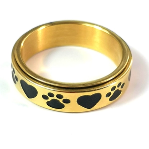 Detailed close-up of golden stainless steel spinner ring with heart and paw prints