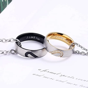 Detail shot of his and hers matching heart rings with I Love You engraved inside