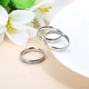 Three-piece silver stainless steel ring set with crystal pavé and smooth bands