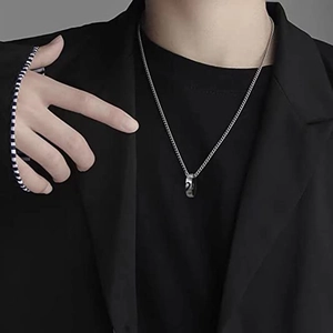 Men's minimalist street style set with a black ring pendant necklace and striped bracelet