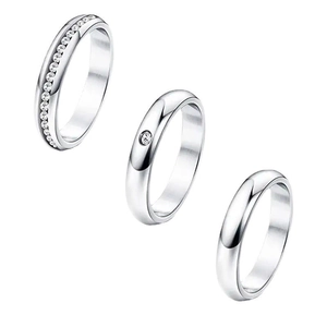 Three-piece stainless steel ring set featuring a crystal eternity band and polished rings