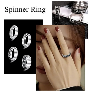 Detailansicht der Edelstahl-Spinner-Ringe mit Sternen, Monden und Blattmustern im Set