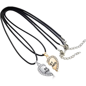 Detailed macro view of Best Friends split heart pendants with crystals on black cords