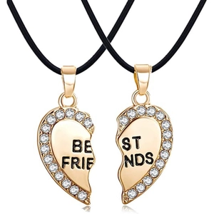 Close-up of golden split heart pendants with crystals and Best Friends engraving
