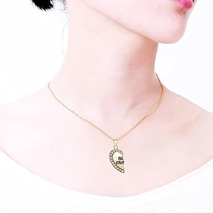 Gold heart-shaped Best Friend necklace with rhinestones worn by a model