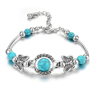 Ethnic bohemian silver bracelet with turquoise beads and hollow butterfly accents