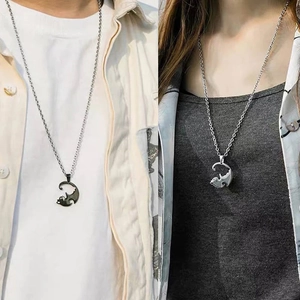 Matching black and silver cat puzzle necklaces for couples in stainless steel