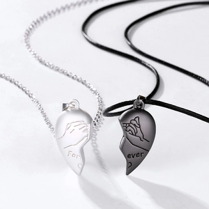 Detail of magnetic heart pendant with pinky promise design and For ever engraving