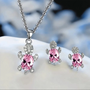 Elegant silver turtle jewelry set with pink stones and sparkling crystal accents