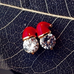 Macro detail of Christmas snowman hat earring with red enamel and clear cubic zirconia