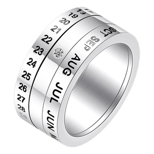 Modern spinning calendar ring in silver stainless steel with small inset cubic zirconia