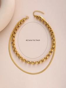 Detail showing 42.5cm double-layered gold necklace with thick links and flat snake chain