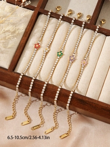 Detail of colorful flower tennis bracelets in gold finish with S.Steel lobster clasp